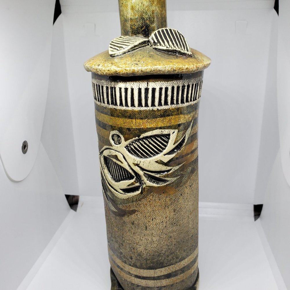 Signed handmade ceramic vase with leaves and lines